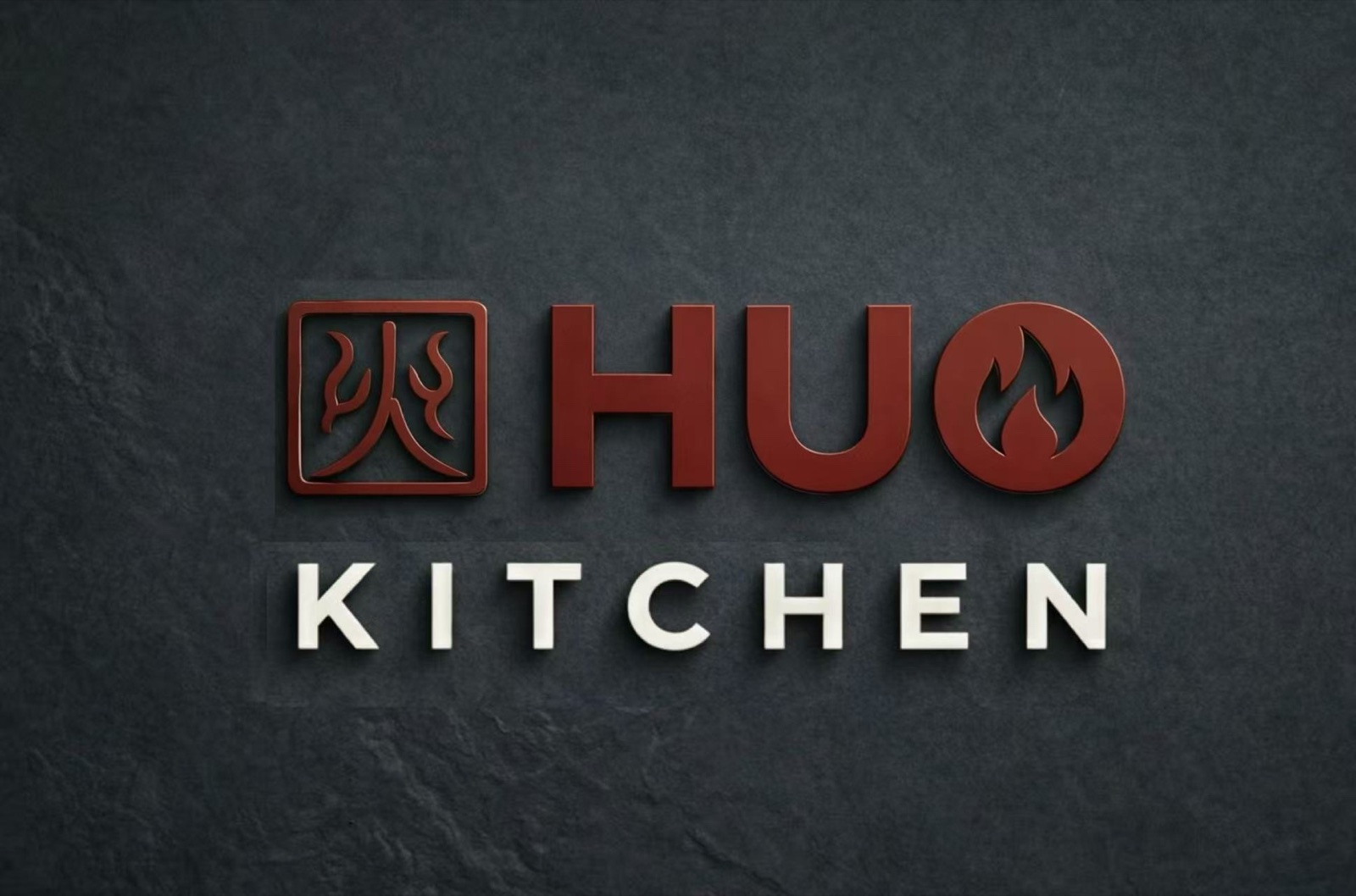 HUO Kitchen brand mark on a dark feature wall